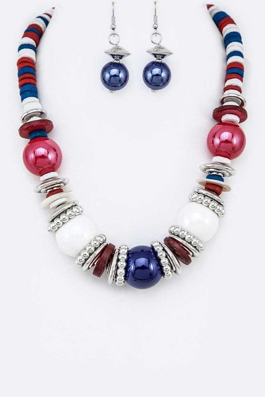 Necklace with red, white, and blue beads on a white background