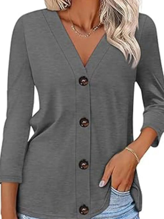 Gray button-up cardigan worn by a person with a neutral background
