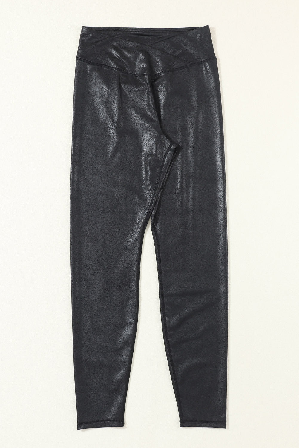 Black leather leggings on a white background