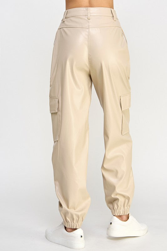 Beige cargo pants worn by a person on a white background