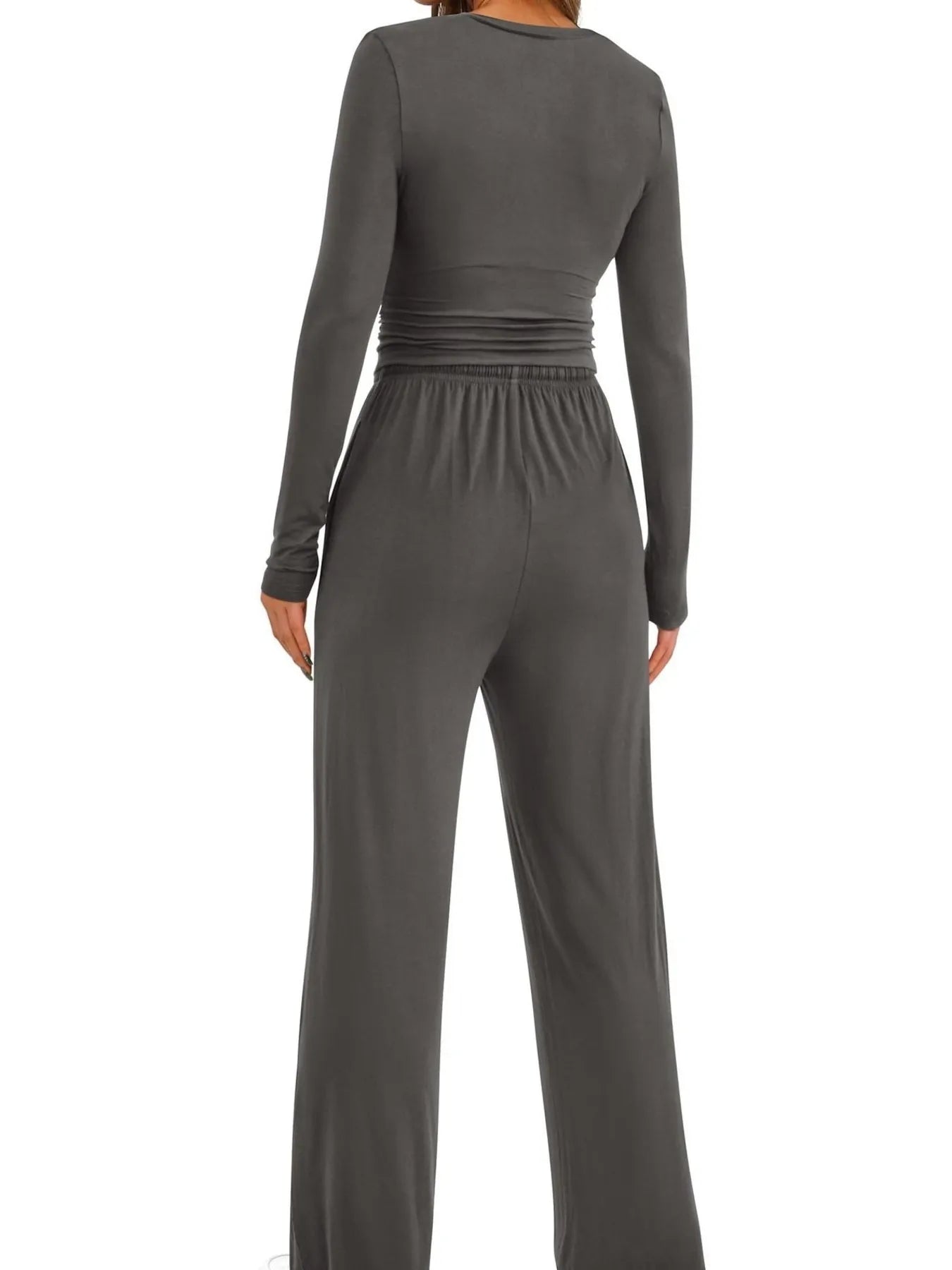 Gray jumpsuit with long sleeves on a white background