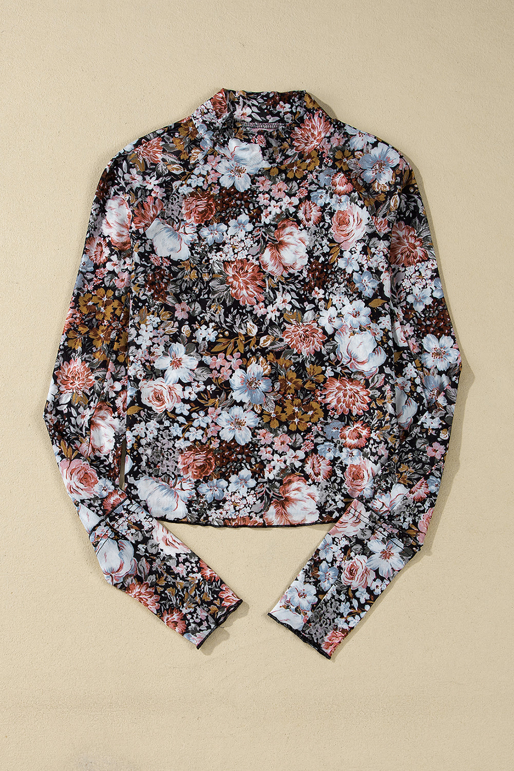 Floral patterned shirt on a beige background
