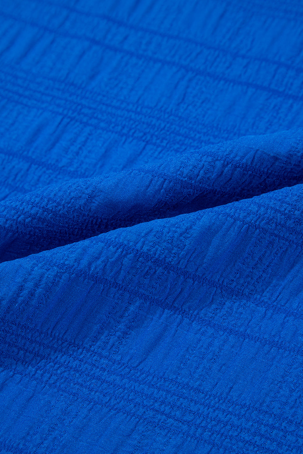 Close-up of textured blue fabric