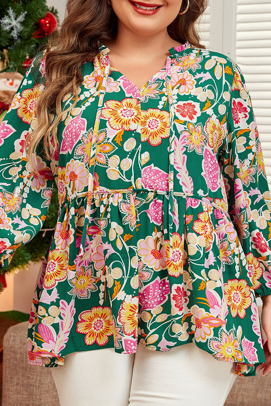 Woman wearing a floral blouse with a green background