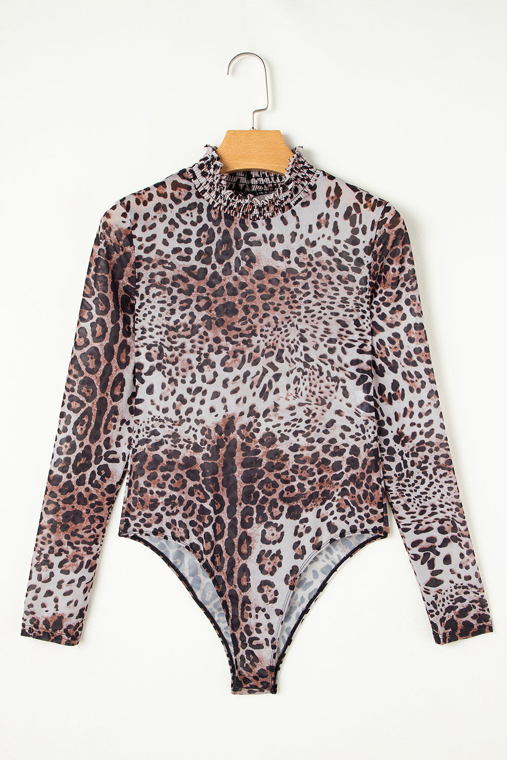 Leopard print bodysuit on a hanger against a white background