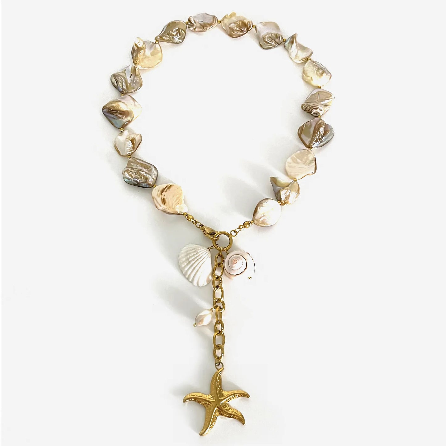 Bracelet with shell beads and starfish charm on a white background