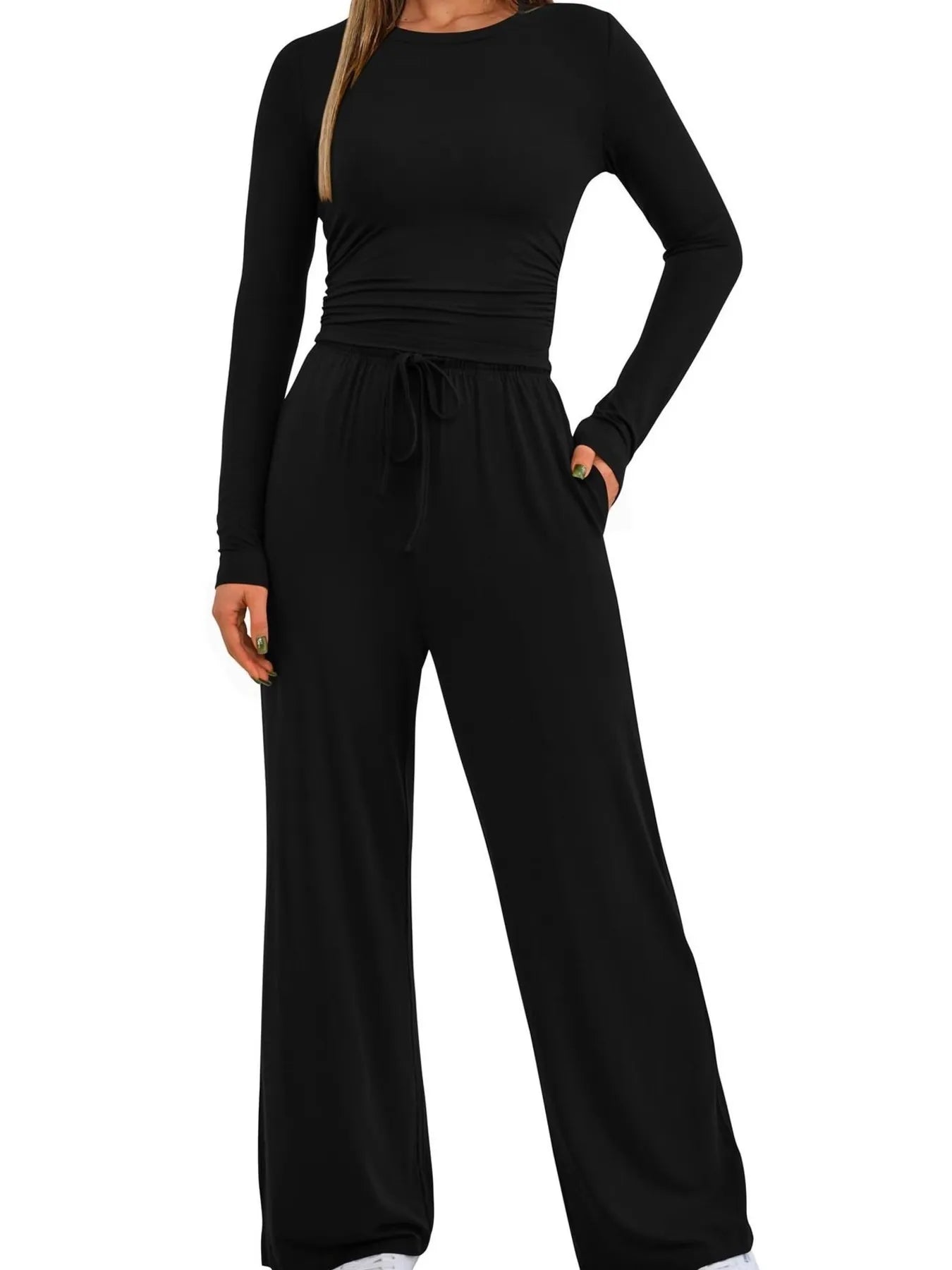Black long-sleeve top and wide-leg pants set on a white background