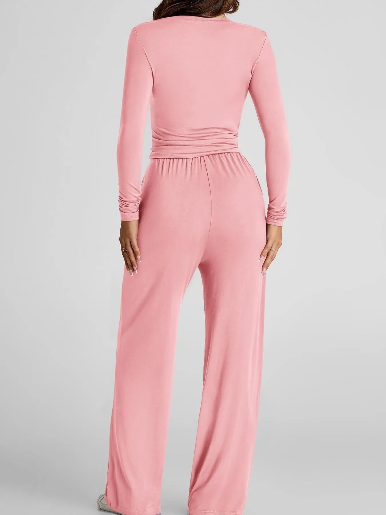 Pink jumpsuit on a gray background