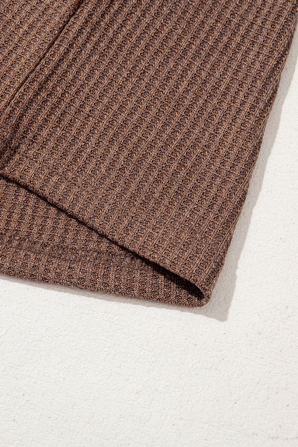 Brown ribbed fabric on a white background