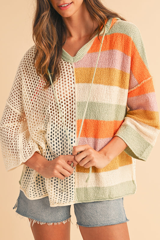 Woman wearing a colorful striped kimono-style garment on a beige background