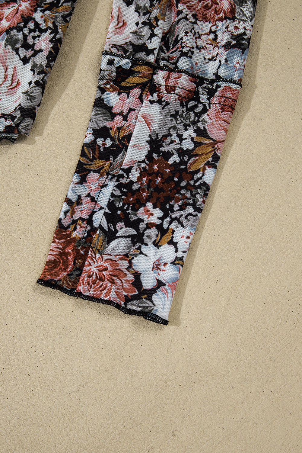 Floral-patterned fabric on a beige background
