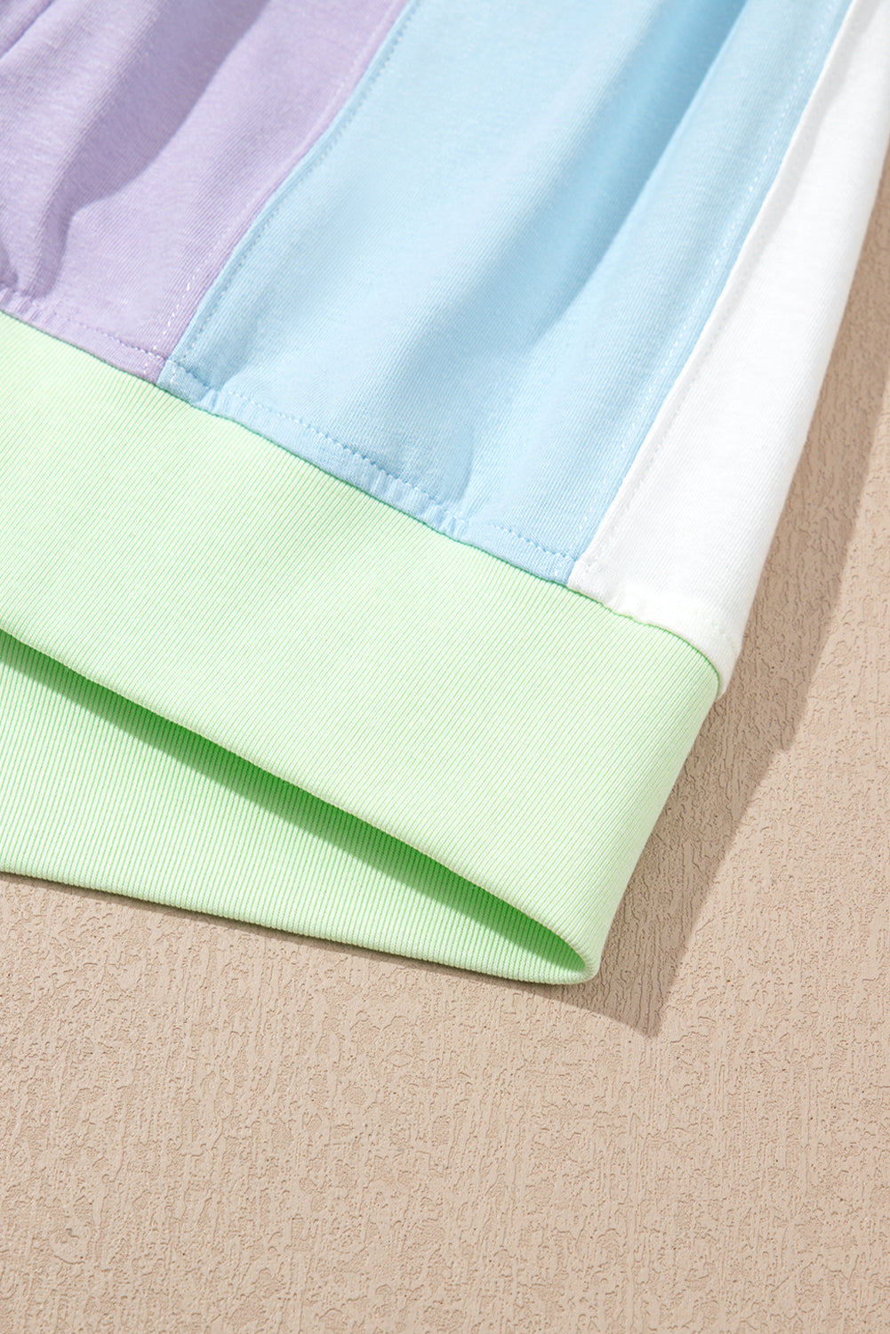 Close-up of fabric with pastel colors on a beige background