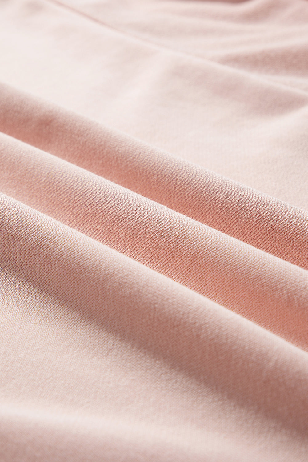 Close-up of pink fabric with folds