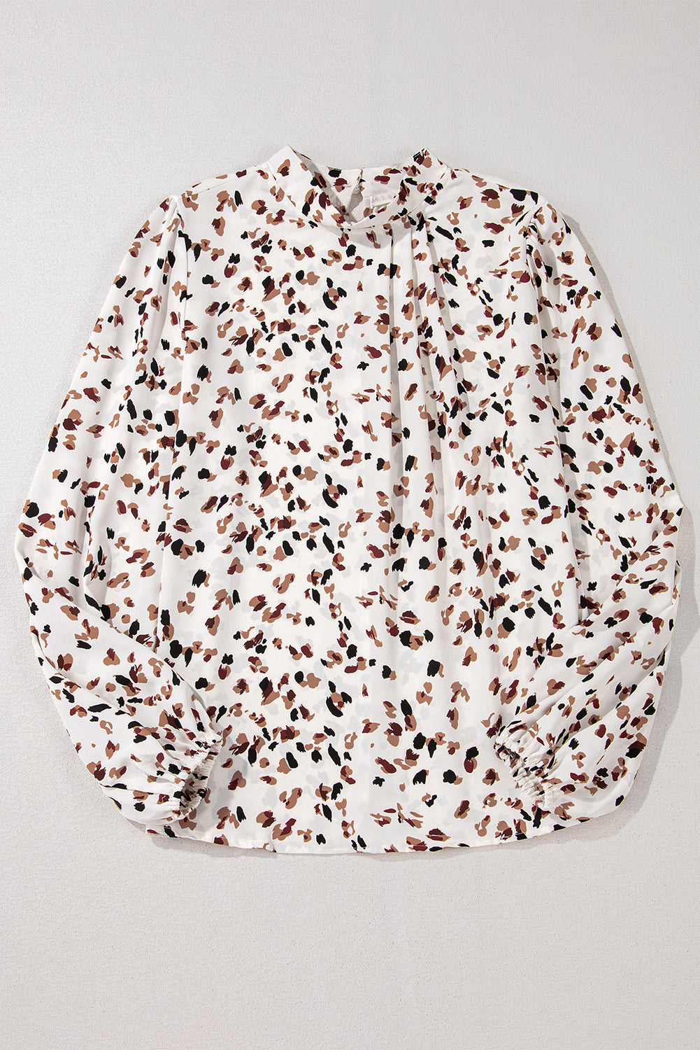 Floral-patterned fabric on a light gray background