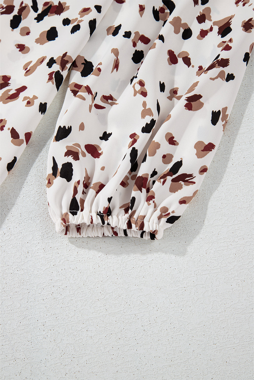 Floral-patterned fabric on a light gray background