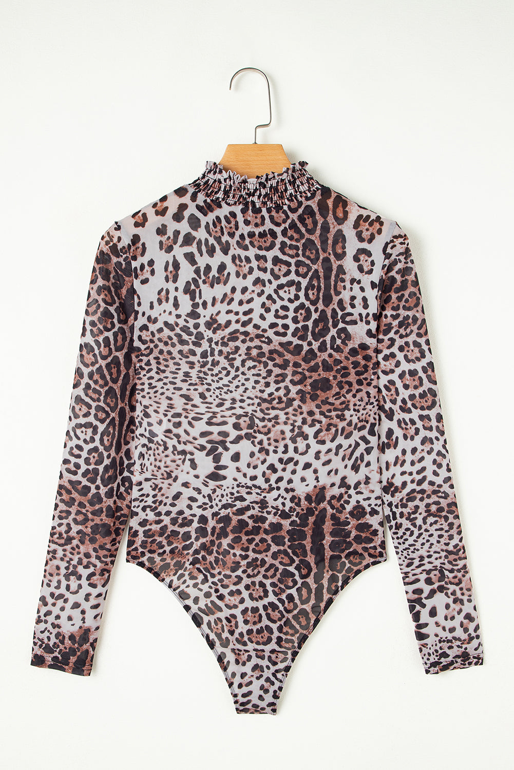 Leopard print bodysuit on a hanger against a white background