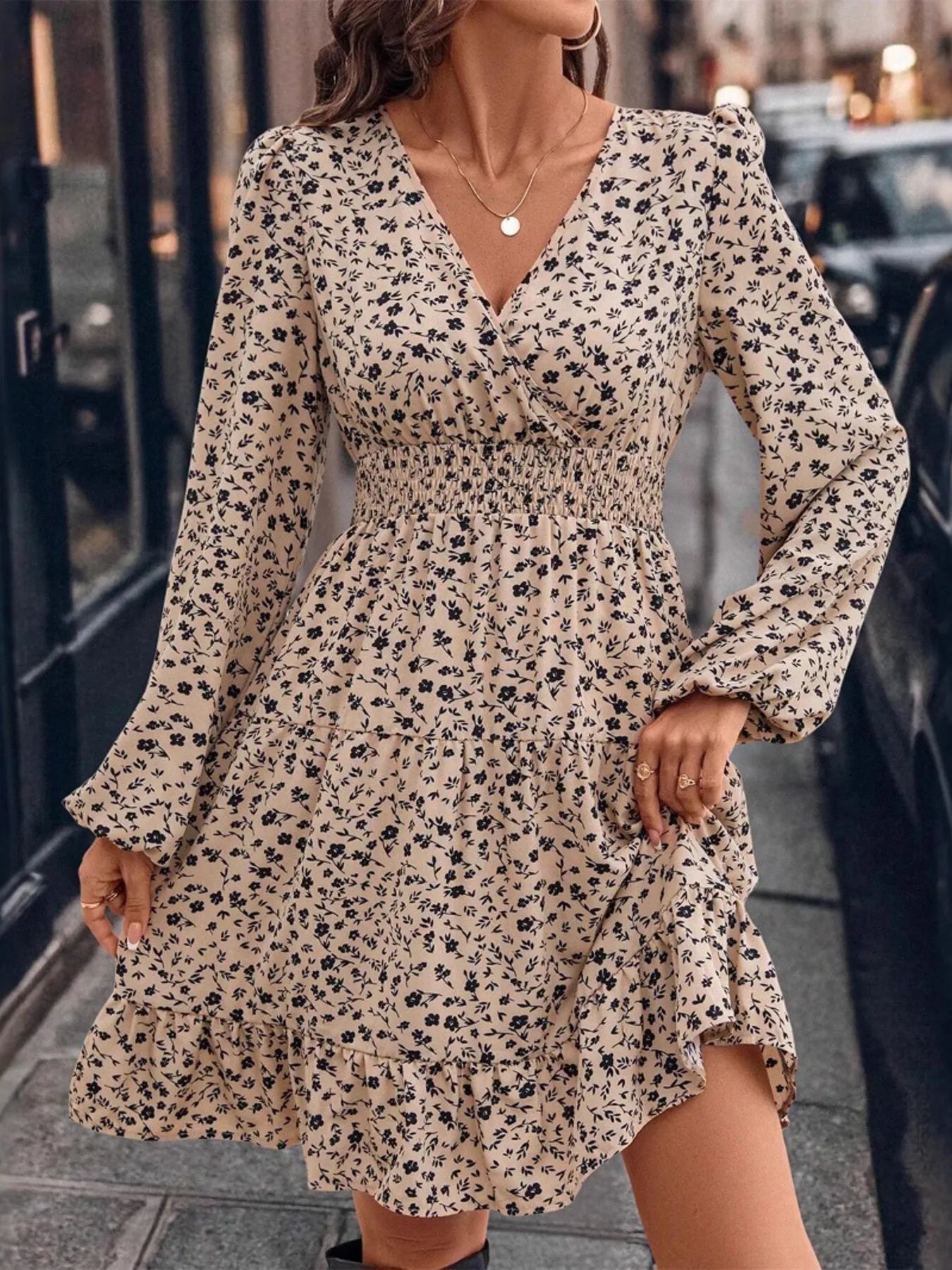 Woman wearing a floral dress on a city street