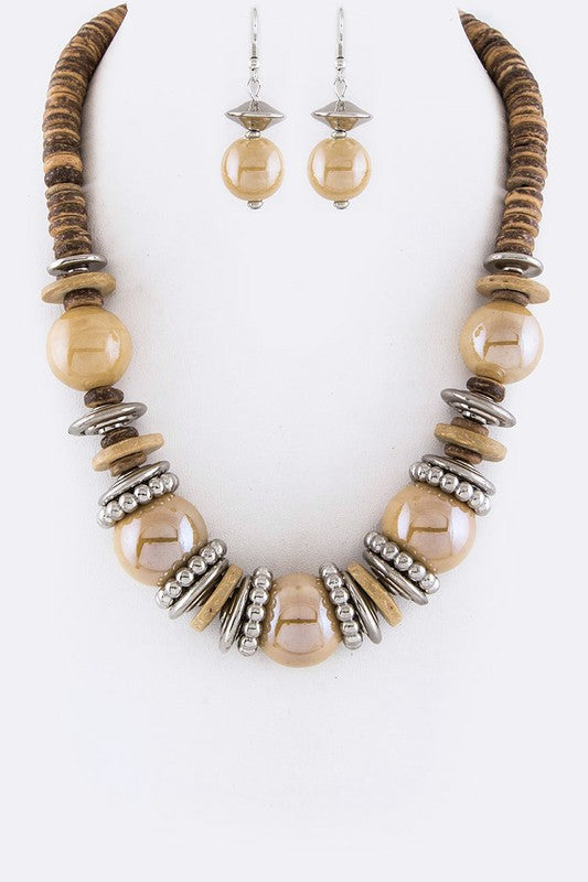 Necklace and earrings set with wooden and beaded design on a white background