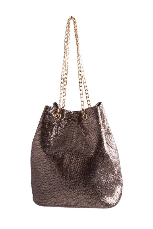 Metallic silver handbag with gold chain handle on a white background