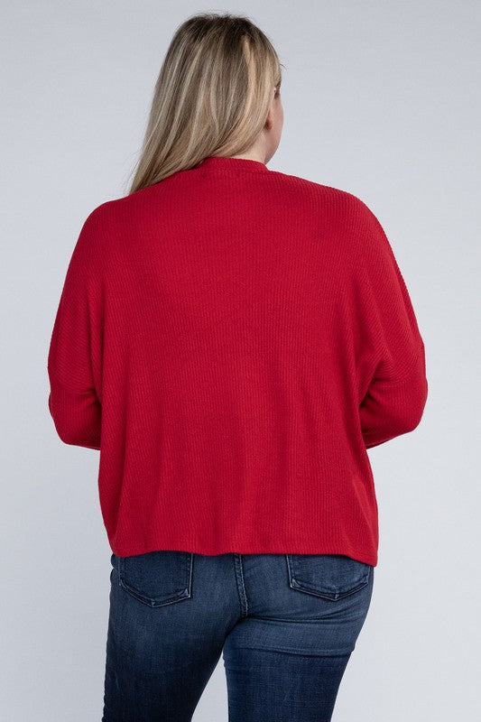 Person wearing a red sweater and blue jeans on a white background