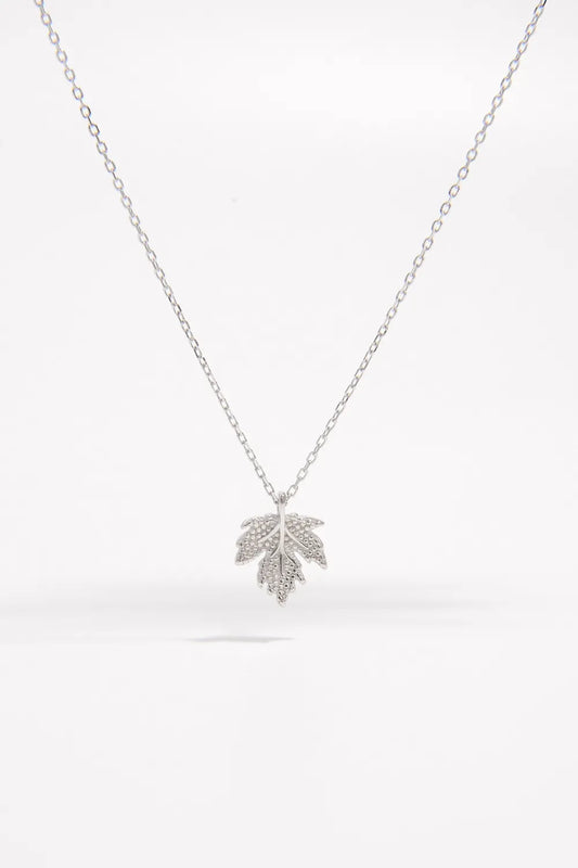 Silver leaf pendant necklace on a white background
