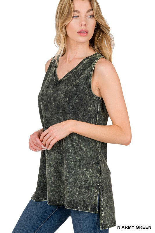 Woman wearing a sleeveless acid-wash top in army green on a white background