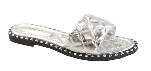 Silver sandal with clear gemstone on a white background