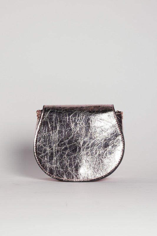 Silver metallic handbag on a light gray background