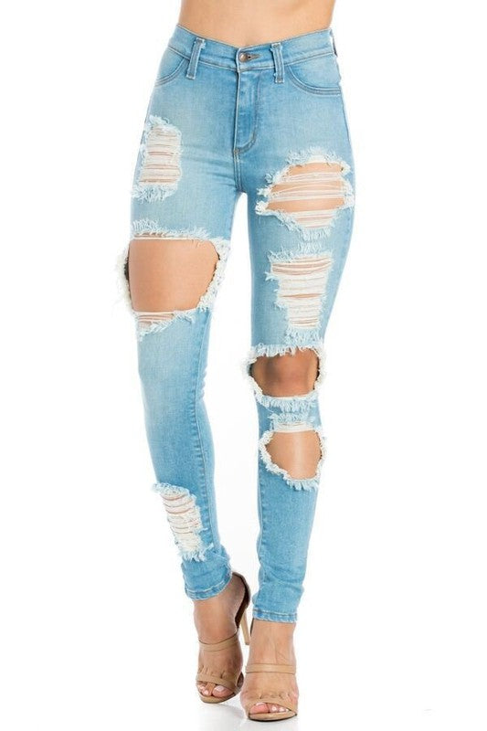 Light blue distressed jeans on a white background