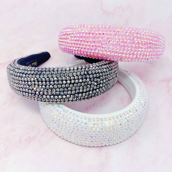 Set of three beaded headbands in pink, silver, and white on a soft pink background.