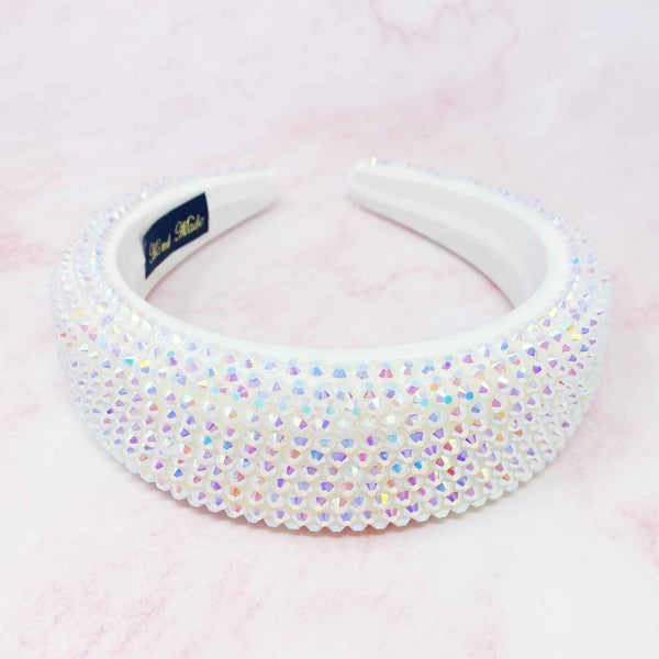 Decorative headband with multicolored beads on a pink background