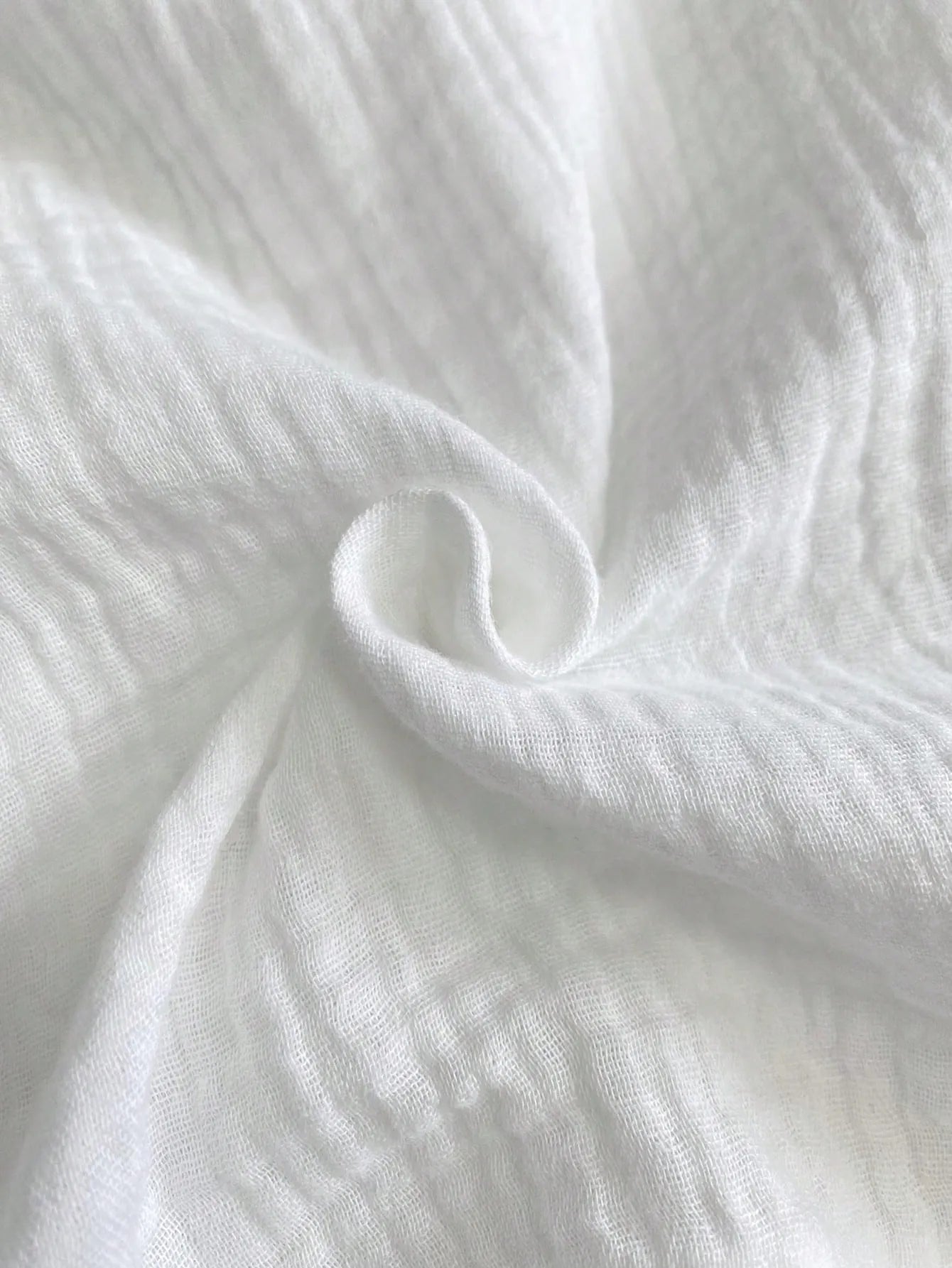Close-up of white fabric with a subtle texture
