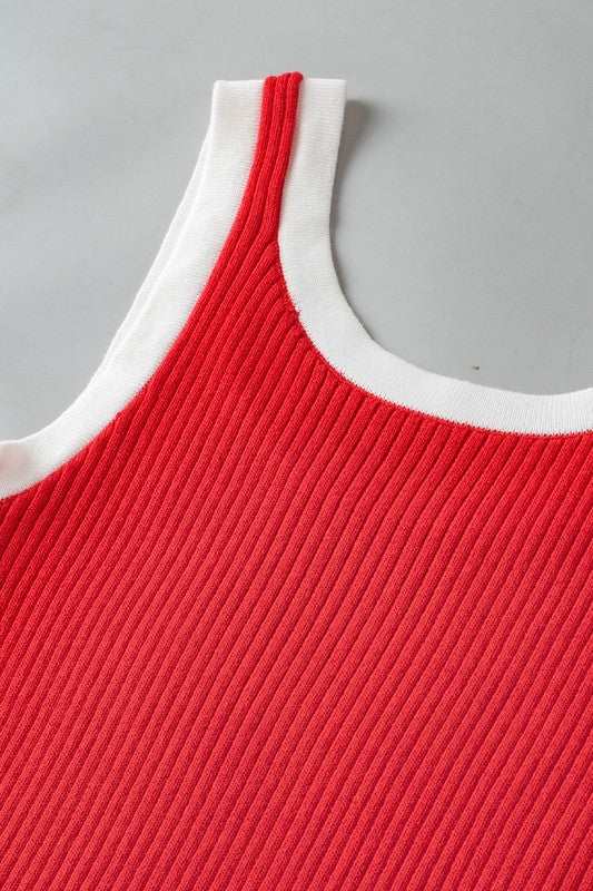 Red ribbed tank top with white trim on a gray background