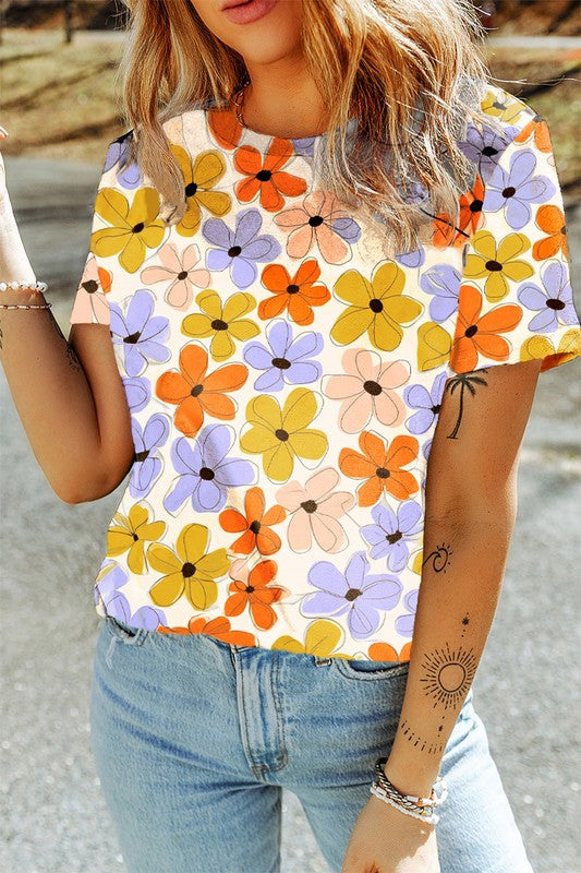 Person wearing a colorful floral shirt with jeans outdoors