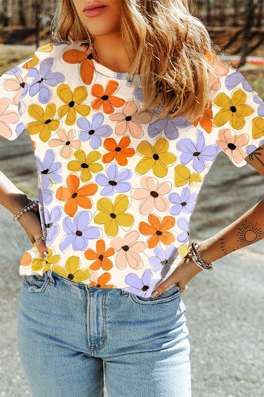 Person wearing a colorful floral shirt with hands in pockets outdoors