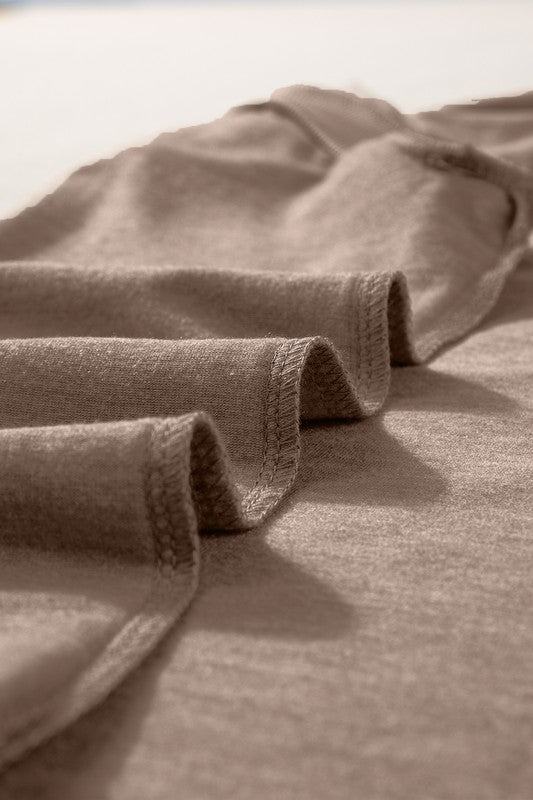 Close-up of beige fabric with a textured pattern