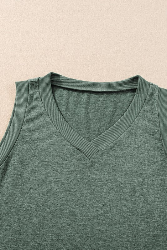 Green sleeveless shirt with a V-neck on a beige background