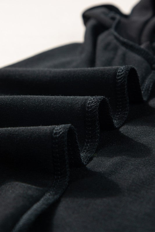 Close-up of black fabric with a blurred background