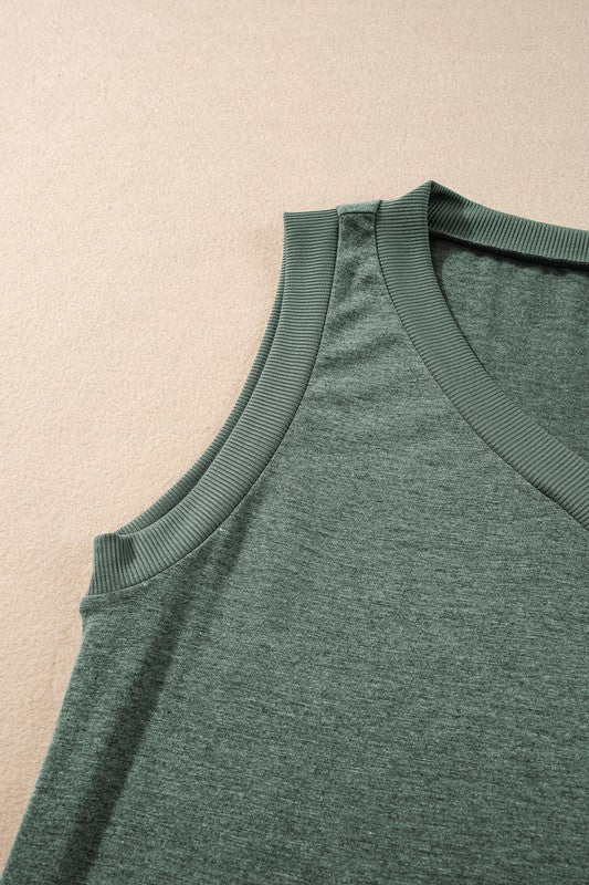 Green tank top on a beige background