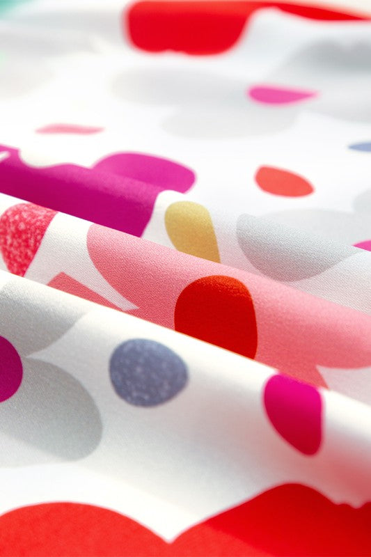 Close-up of fabric with colorful polka dot pattern