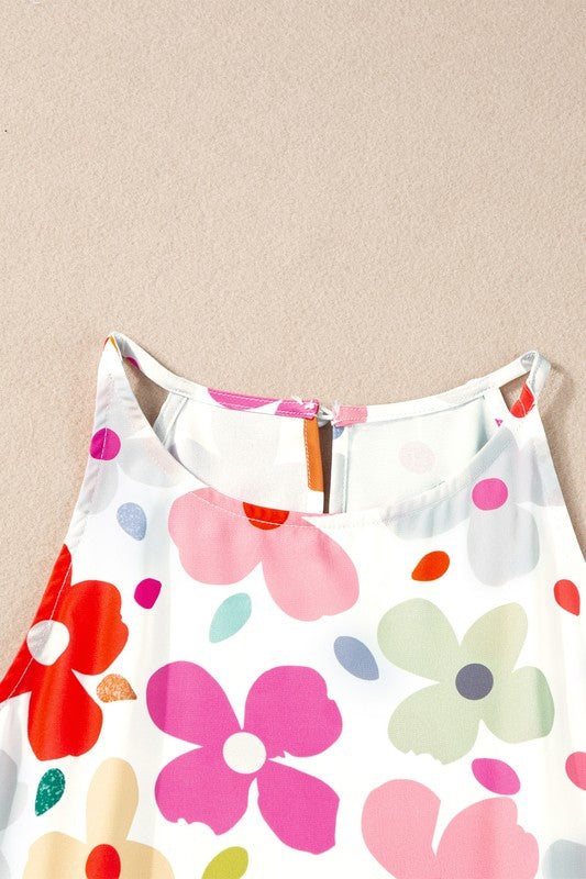 White tank top with colorful floral pattern on a beige background