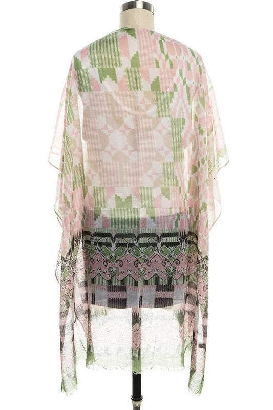 Mannequin wearing a sheer floral patterned top with a white background