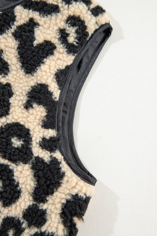 Leopard print fabric with a black trim on a white background
