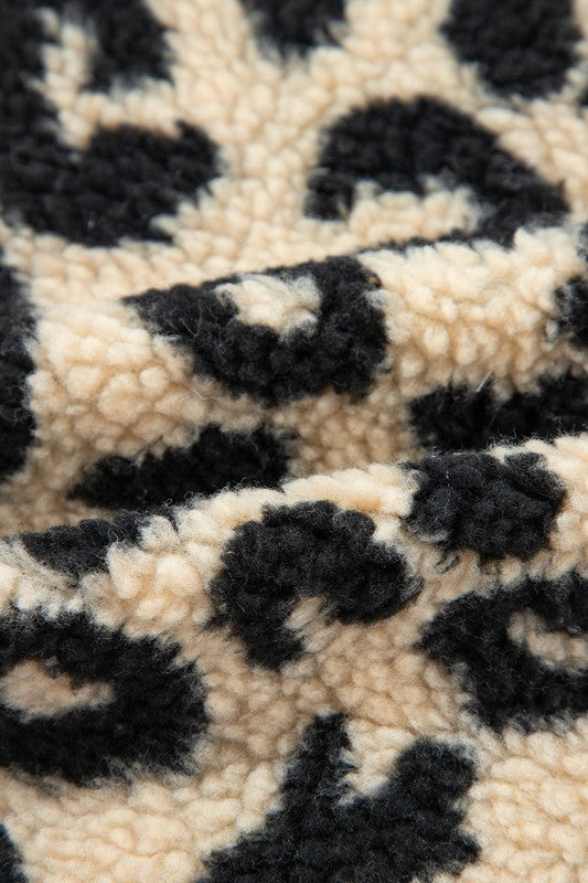 Close-up of a textured fabric with a leopard print pattern.