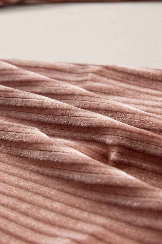 Close-up of a textured pink fabric surface