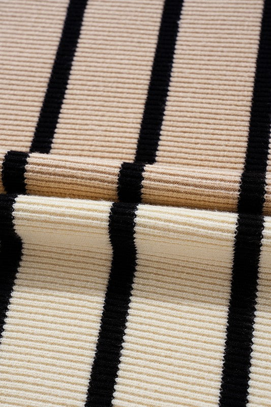 Close-up of a textured fabric with black and beige stripes