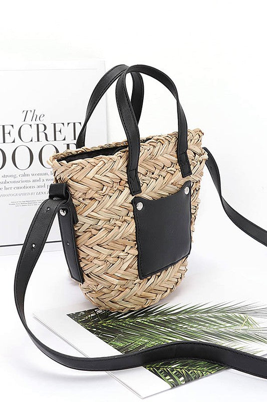 Woven handbag with black accents on a white background