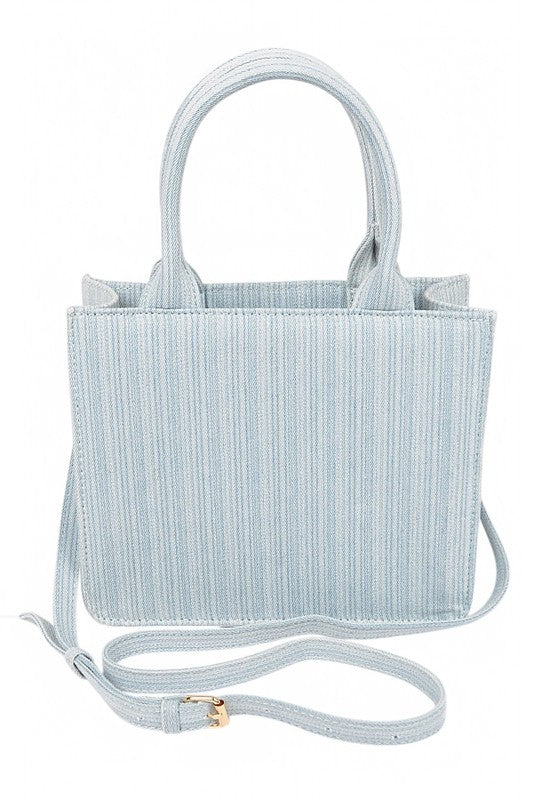 Light blue textured handbag with a strap on a white background