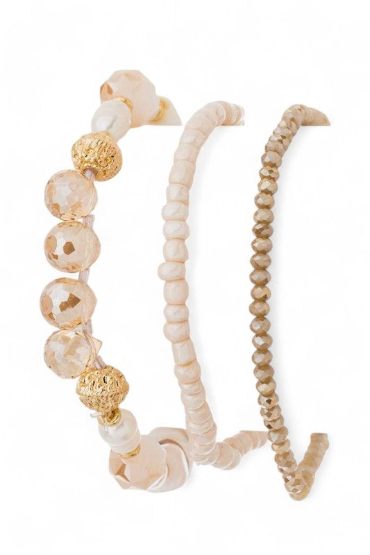 Set of beaded headbands with gold accents on a white background