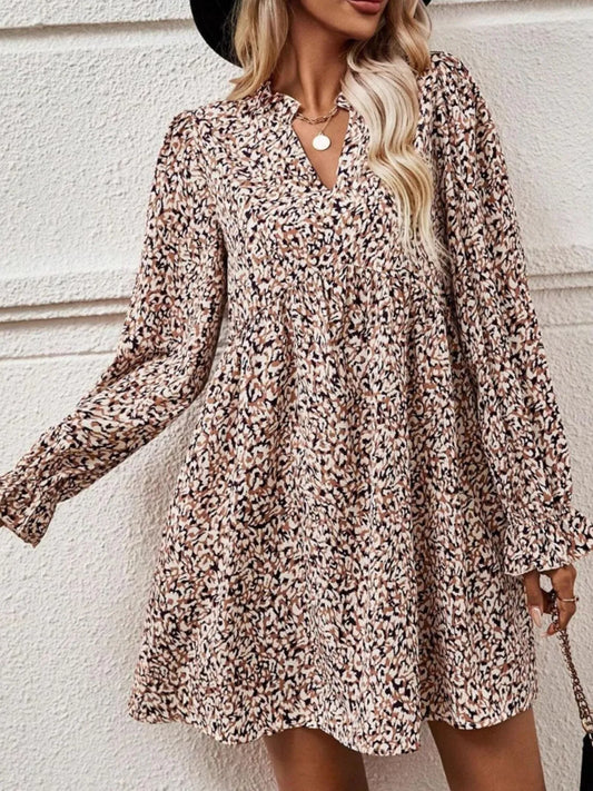 Woman wearing a floral dress against a light background